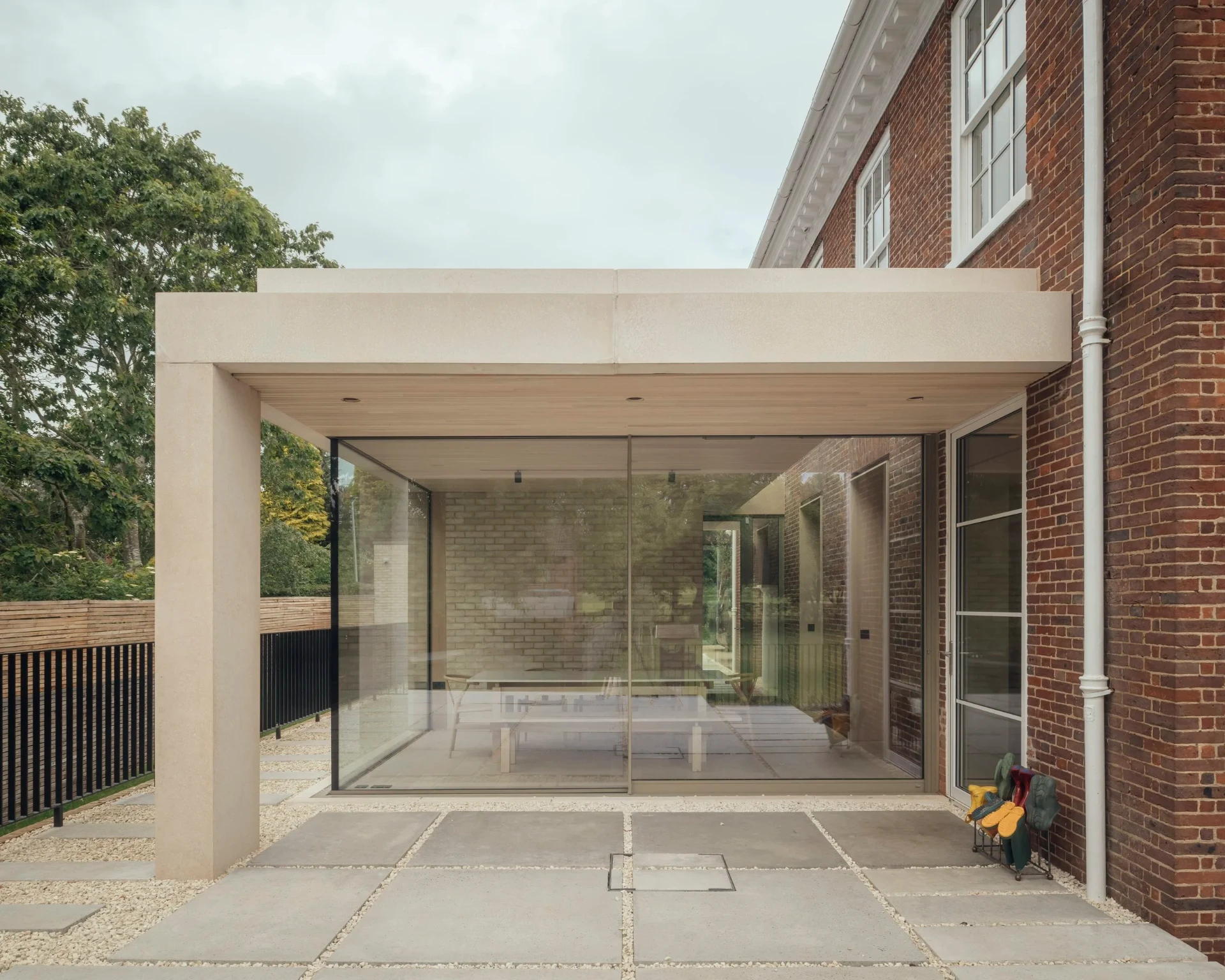 Contemporary glazed pavilion extension with stone canopy at a Barnton home in Edinburgh