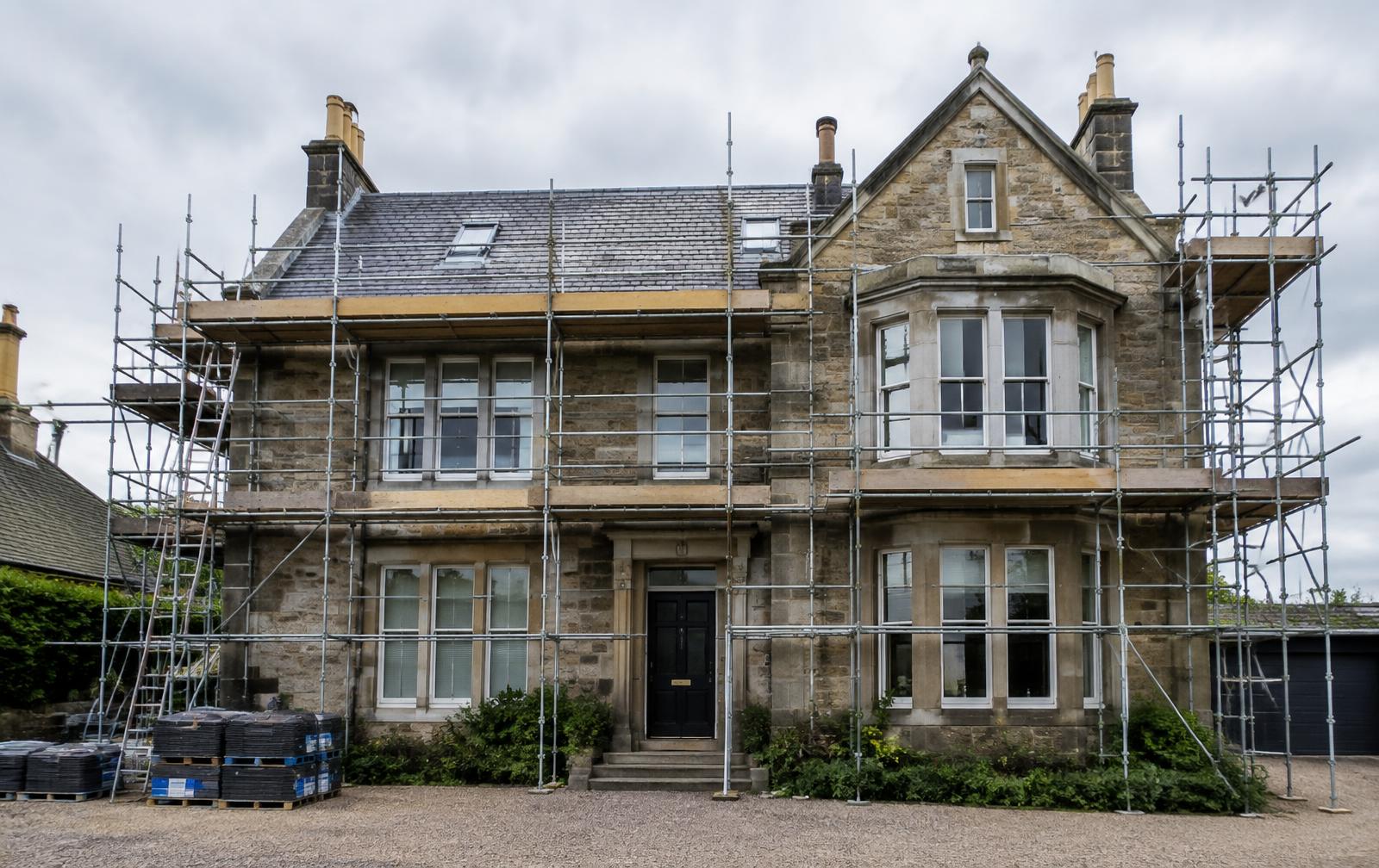 Stone Edinburgh villa with scaffolding during a major renovation